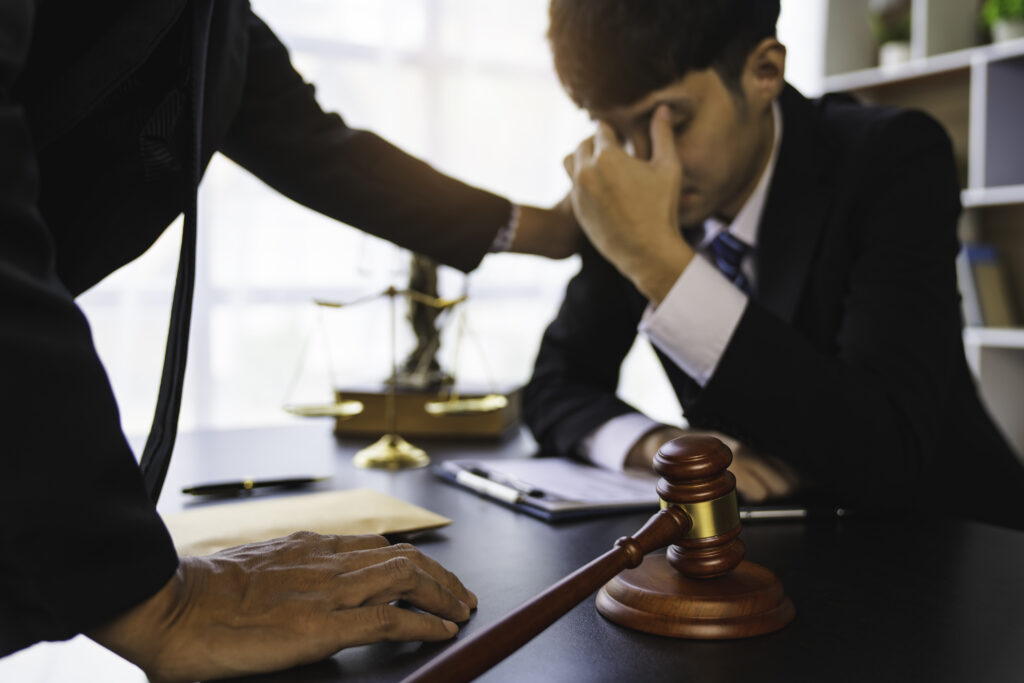 A lawyer or judge is encouraging. In a client's courtroom at a lawyer's office, litigation consultation concept with lawyers.