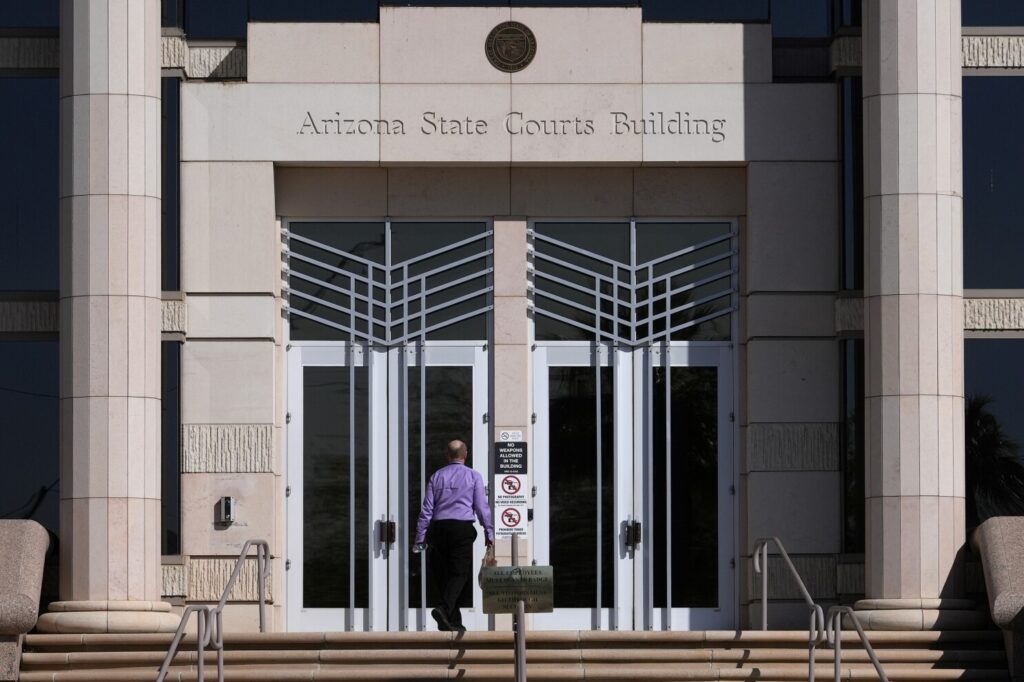A man enters the Arizona Supreme Court building, Wednesday, April 10, 2024, in Phoenix.